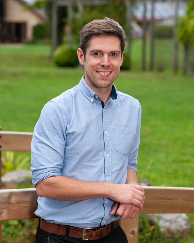 Relaxed profile photograph of charity executive in an outdoor setting
